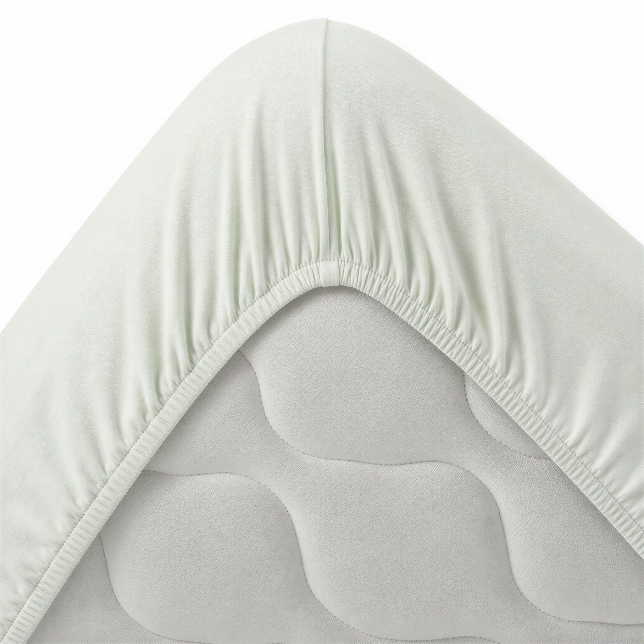 Bettecke mit umlaufendem Gummizug – mintgrünes Spannbettlaken im Detail